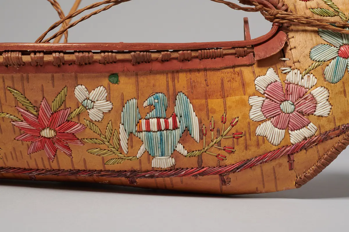 Model canoe with flowers and U.S. eagles