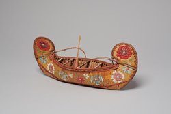 Model canoe with flowers and U.S. eagles