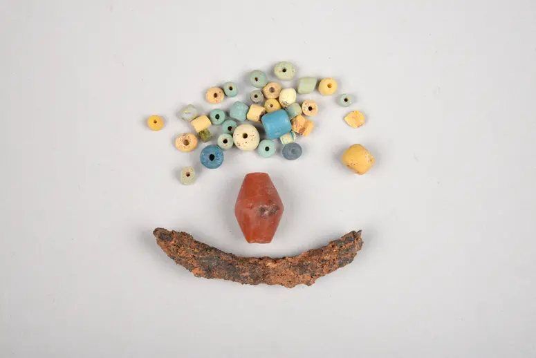 Urn Content: Beads and Human Teeth