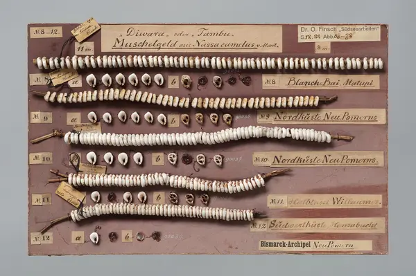 Shell money on pasteboard