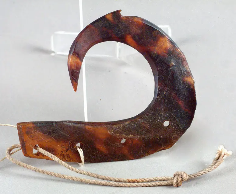 Pendant shaped like a fishing hook