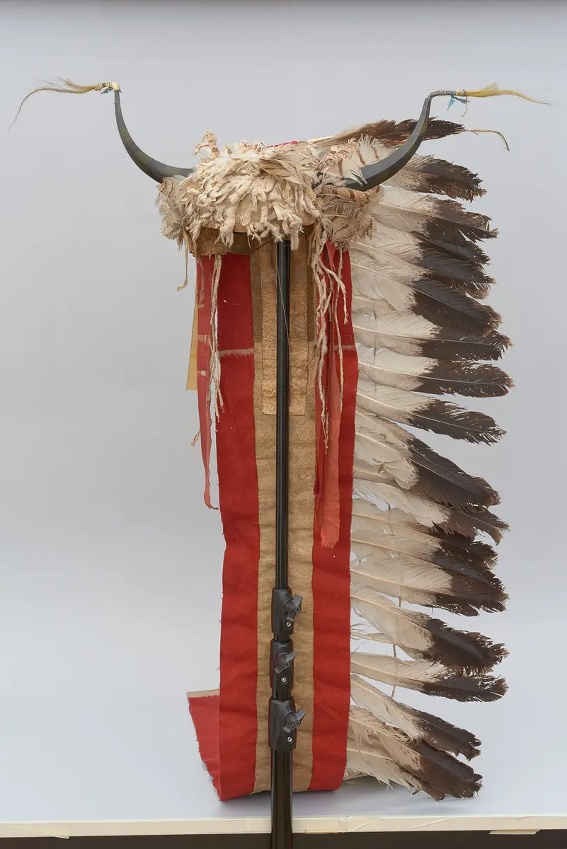 Split-horn headdress with eagle feather trailer