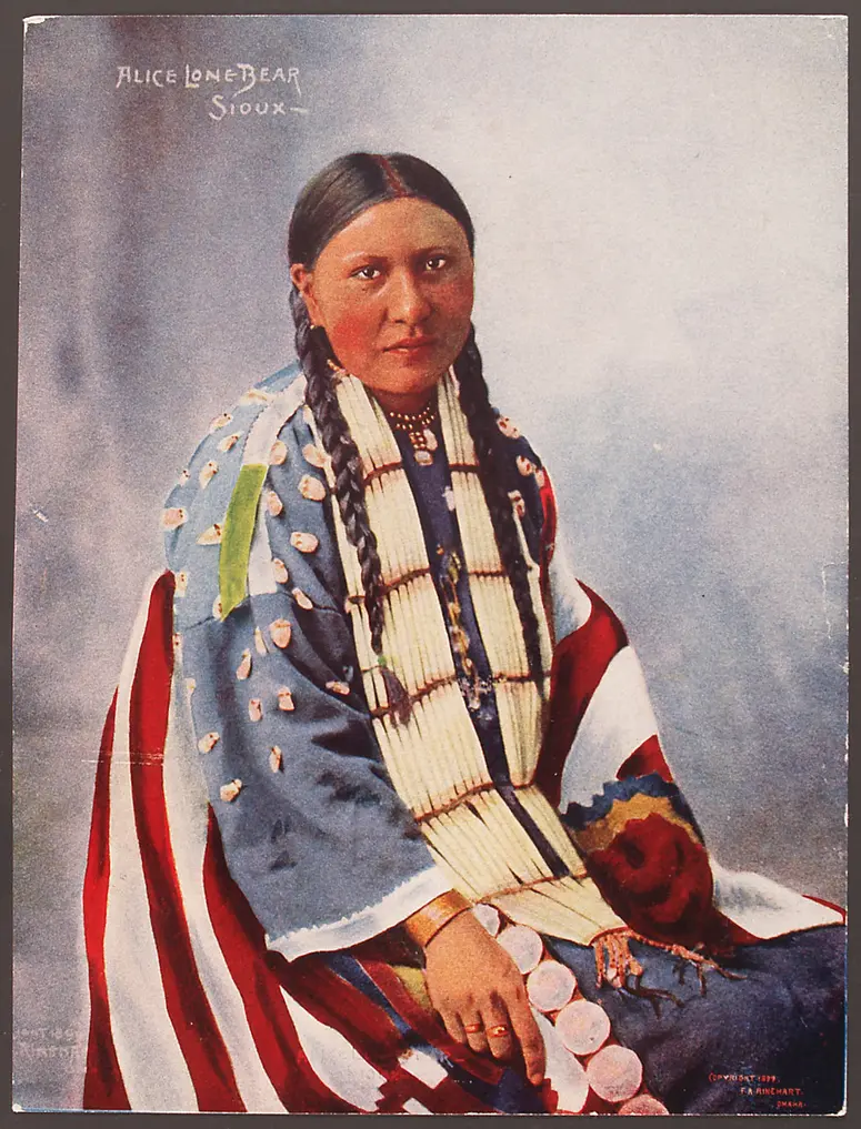 Alice Lone Bear in woven blanket with deer teeth