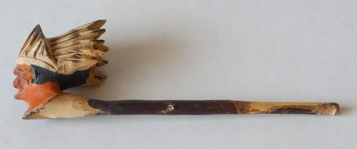 Tobacco pipe with carved American Indian face