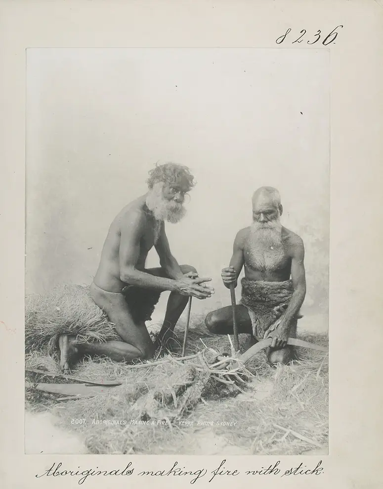 Aboriginals making fire with stick