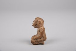 Knieende Figur