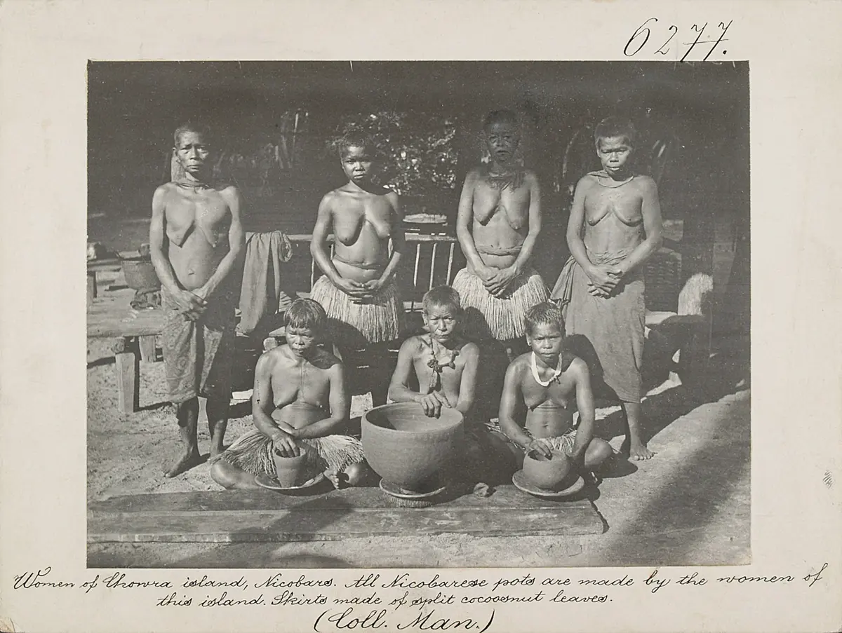 Women of Chowra island, Nicobars. All Nicobarese pots are made by the women of this island. Skirts made of split cocoosnut leaves