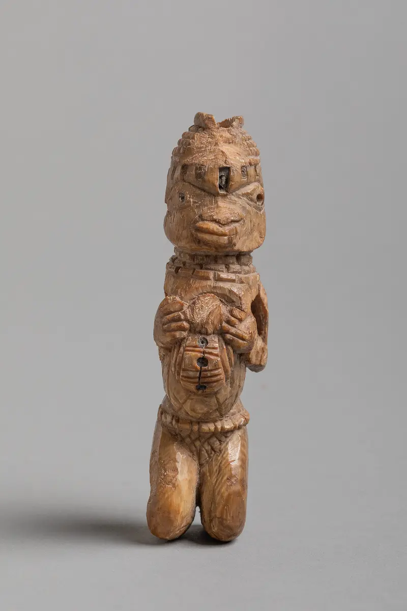 Kniende Figur
