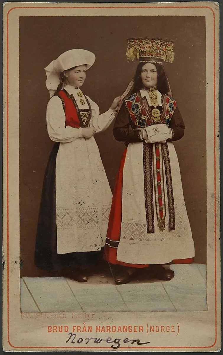 Two wax figures in female and bridal traditional costumes from Hardanger, Norway
